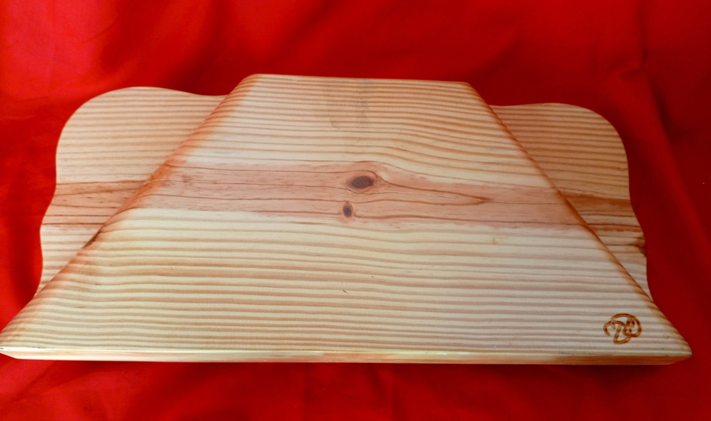 A trapezoidal, carved gusli.